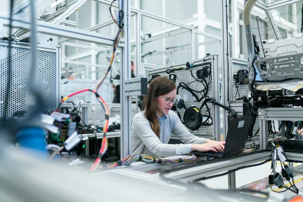 Engineer working on industrial automation equipment